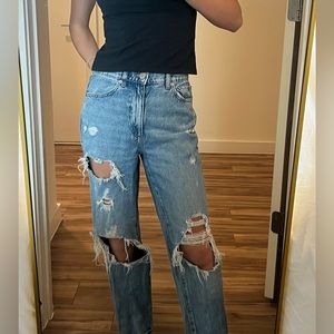 Garage ripped blue jeans